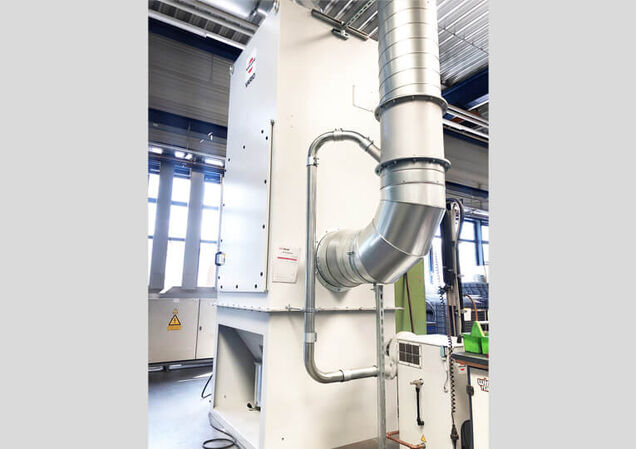Current status: Totally fume free. Ultimate success was achieved with an extraction system that operates sufficiently well to recirculate the filtered air back into the plant during winter. Employees can now breathe fresh air in their workplace.
